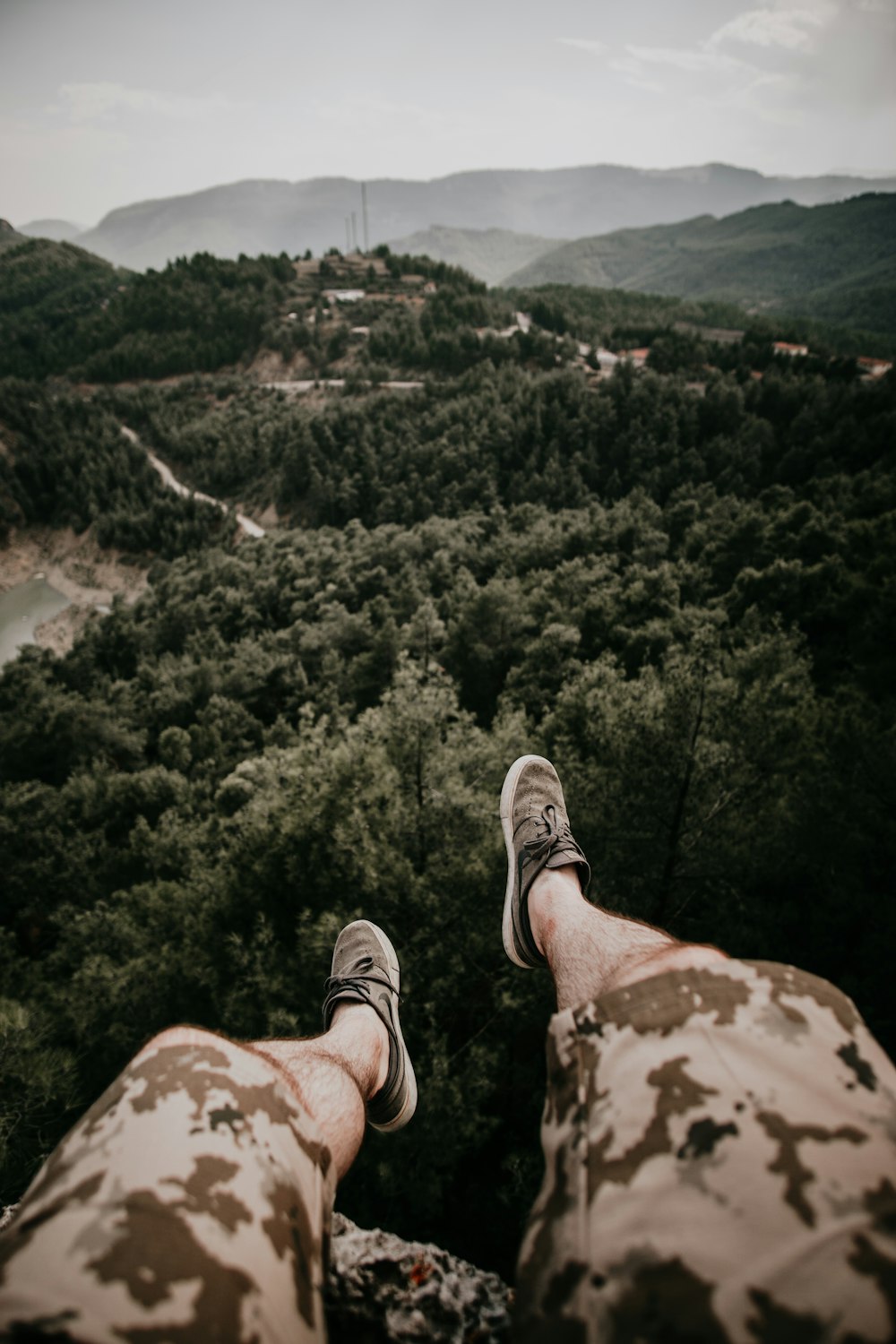 person sitting facing the forest