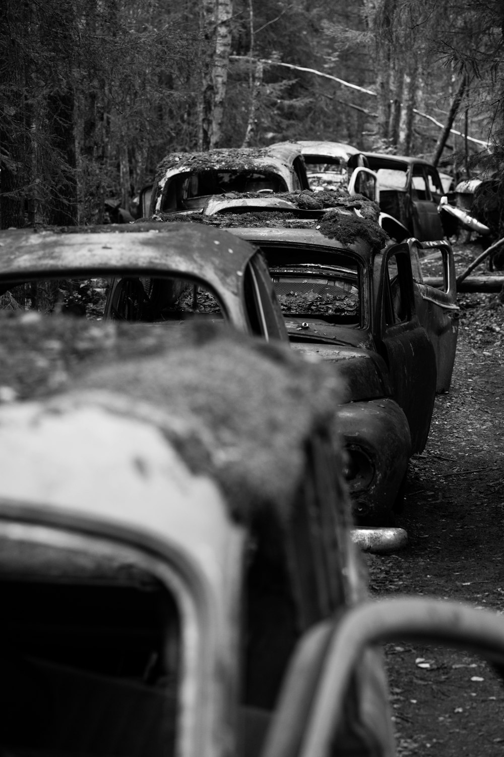 grayscale photography of wreck cars
