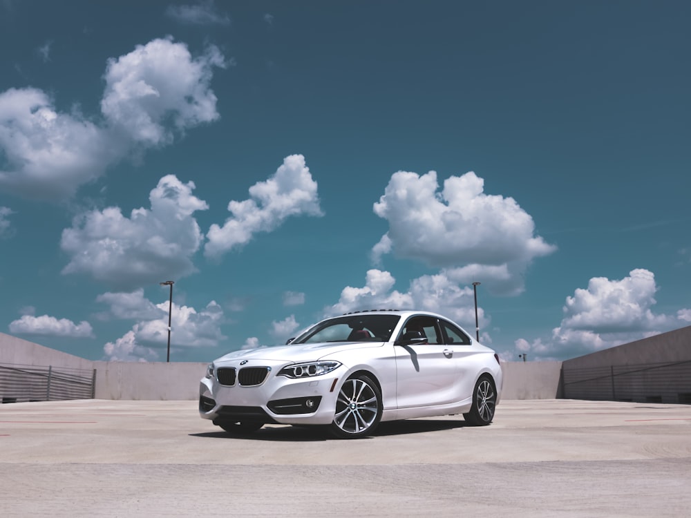 parked white BMW coupe