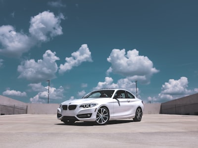 parked white bmw coupe bmw google meet background