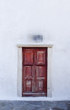 red wooden 6-panel door