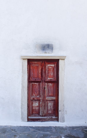 red wooden 6-panel door