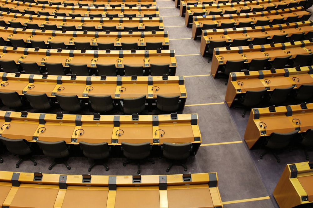 rows of tables and chairs in a large room