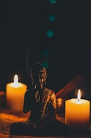 Soft candlelight flickering beside a small statue of Lord Mahadeva, evoking warmth and reverence.