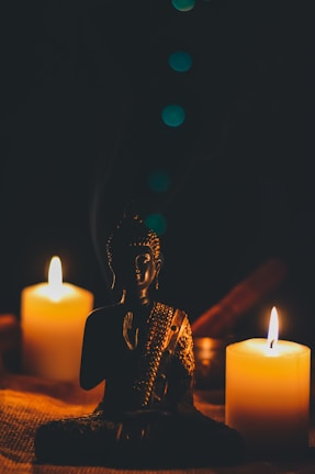 A peaceful evening meditation session with soft candlelight and Shiva idol in the background.