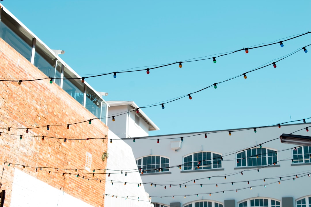 string lights near building during daytime