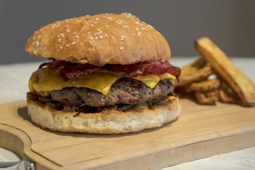 burger on brown wooden board