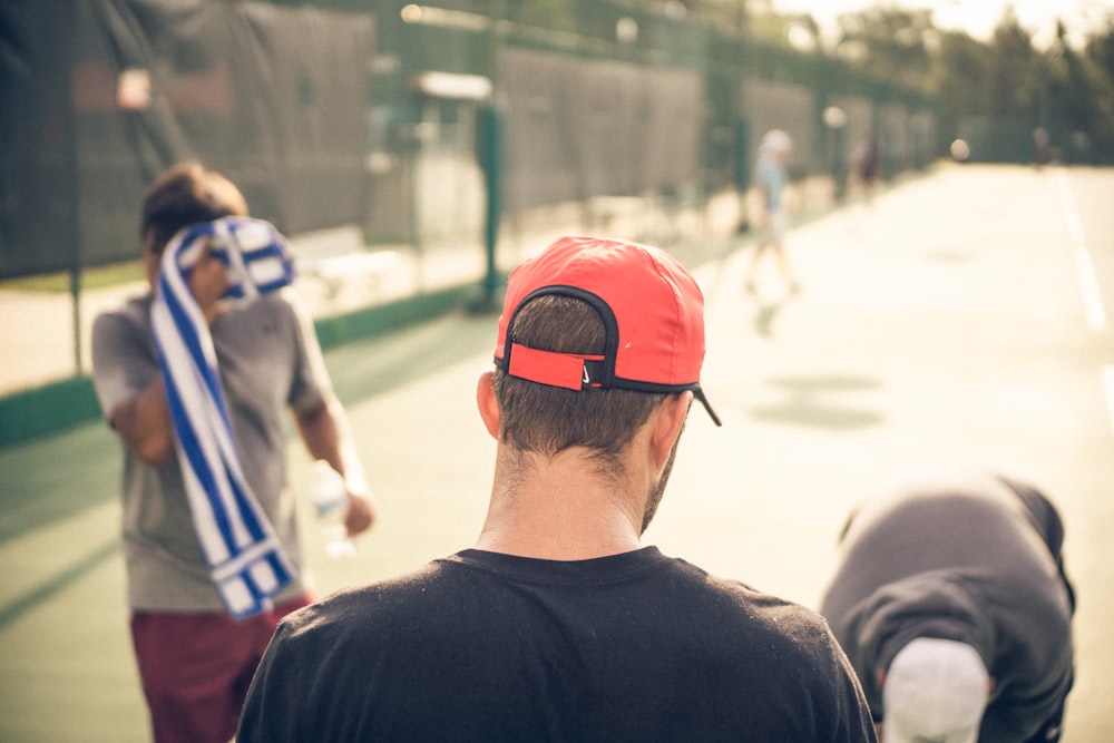 man wearing red cap