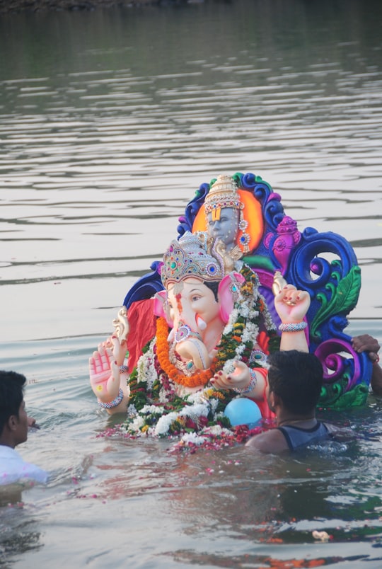 person holding hindu deity figurine in Mirzapur India