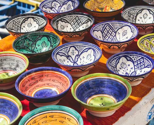 Painted bowls on a stall — Taghazout, Morocco