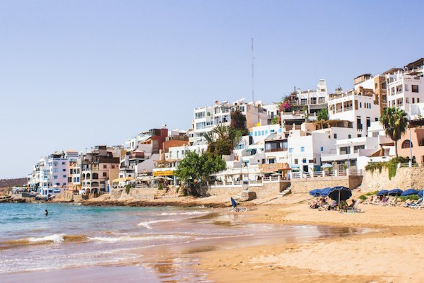 White building near sea during daytime — Agadir, Morocco