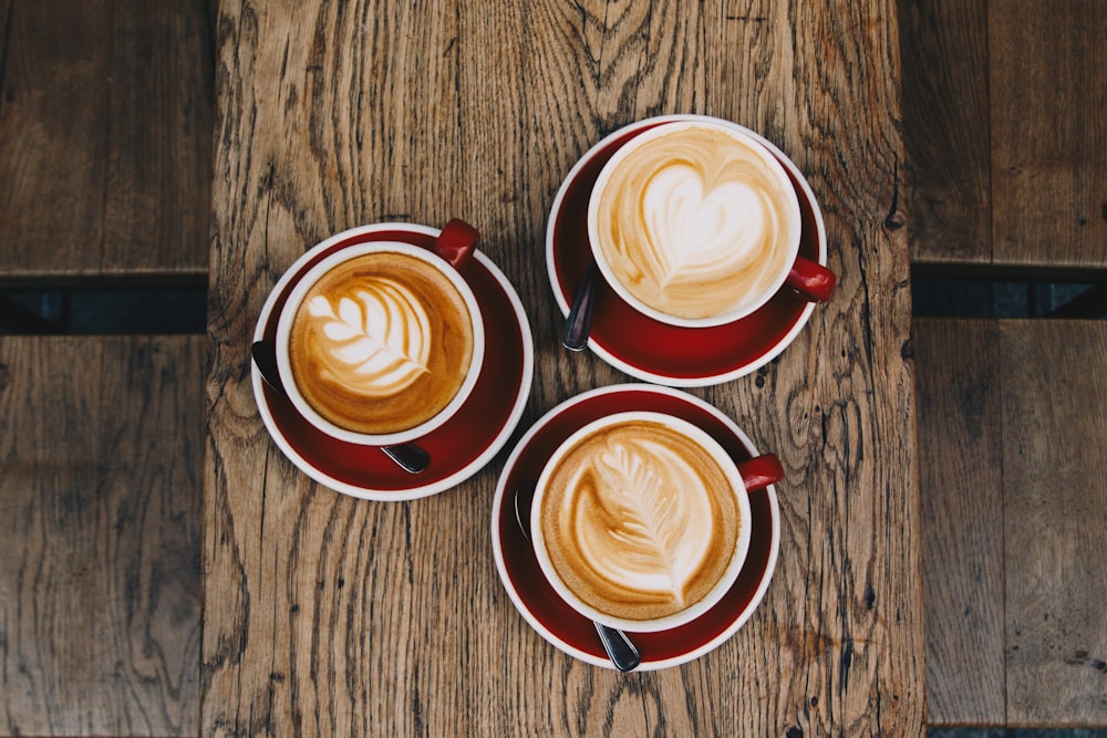 flat lay photography of three cafe latte