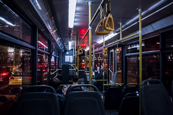 Interior of a modern transit bus with rows of passenger seats, showing the rider experience on new RTC service