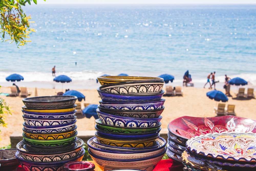 assorted-color plates near beach