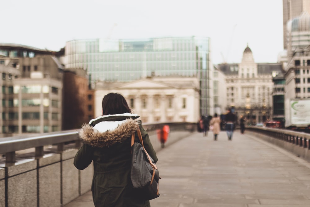 woman walking on bridge