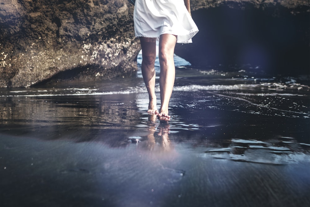 person walking on wet pavement