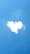 A cloud shaped like a heart against a bright blue sky.