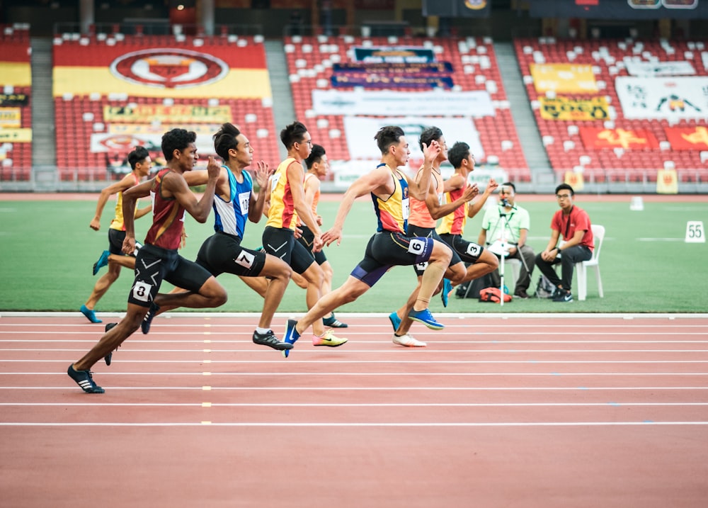 group of man running on the field