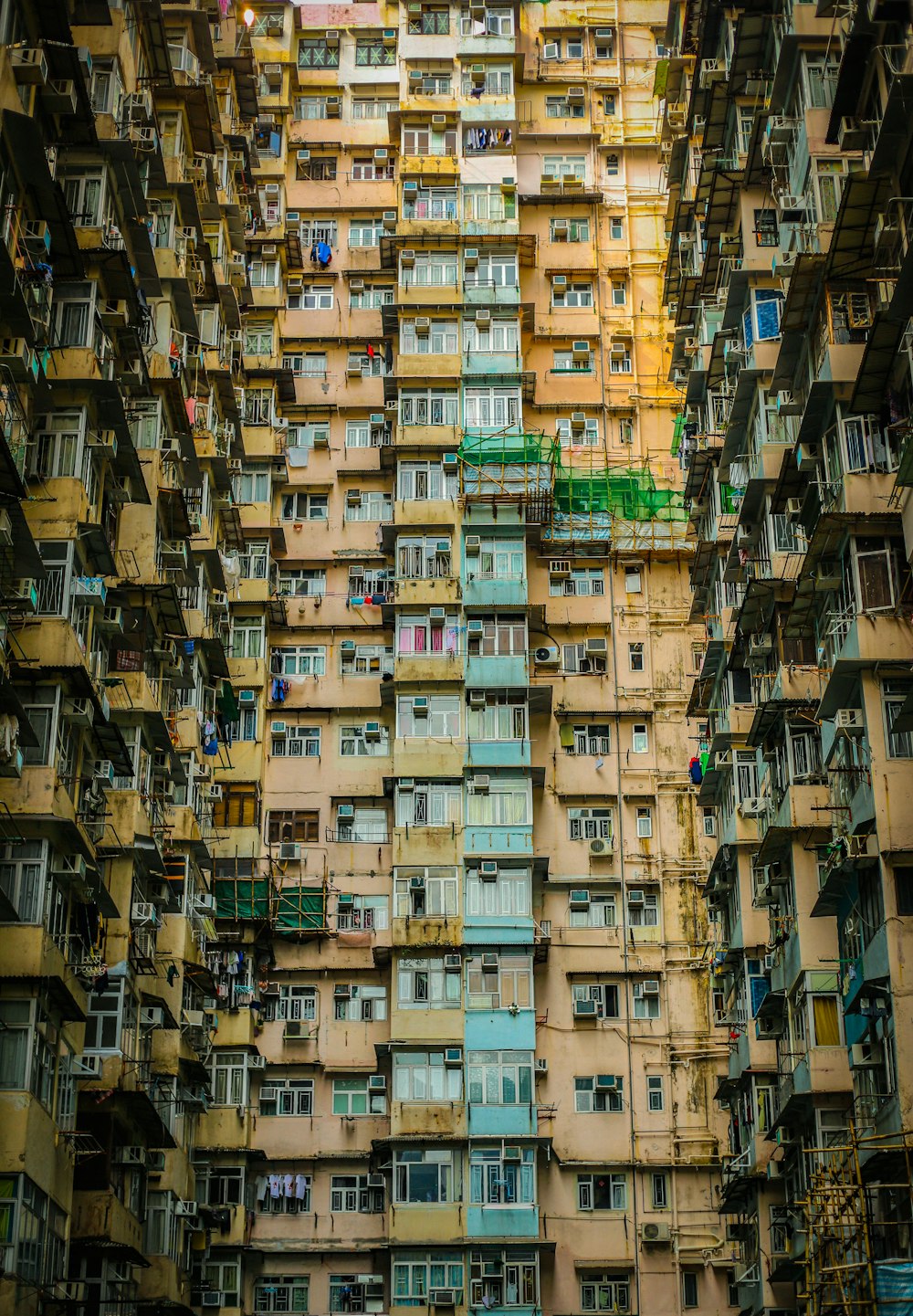 low angle photography of brown and green concrete building