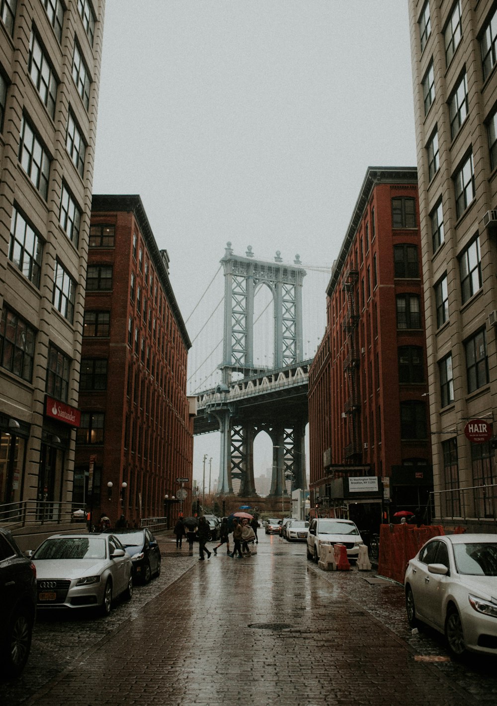 photo of high rise building and a bridge as background