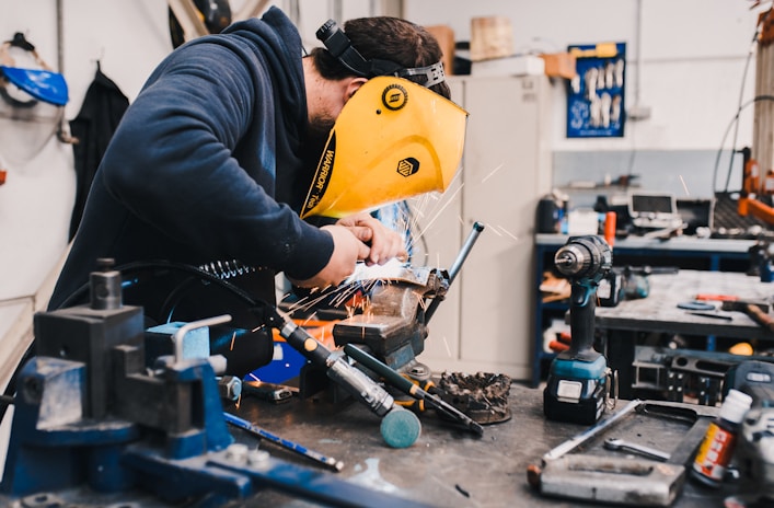 man wearing black hoodie using welding tool  Provide Custom Product Sourcing Services?
