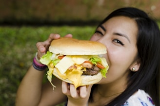 woman eating hamburger