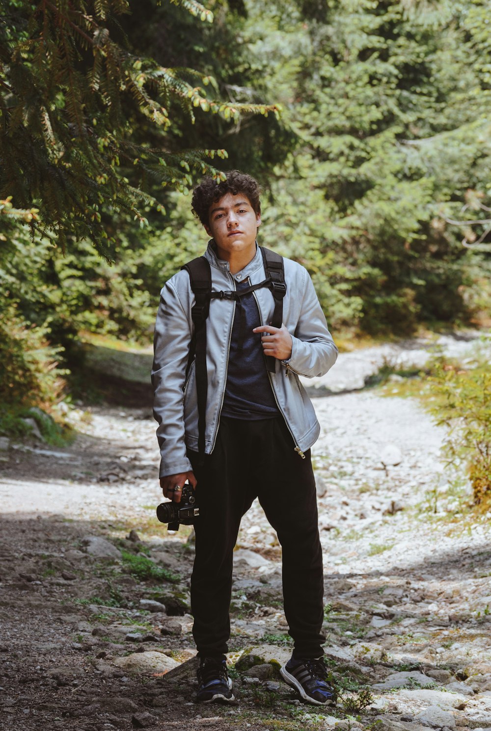 man with backpack in the forest