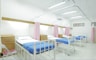 empty hospital bed inside room