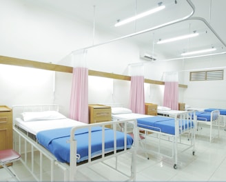 empty hospital bed inside room