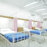 empty hospital bed inside room