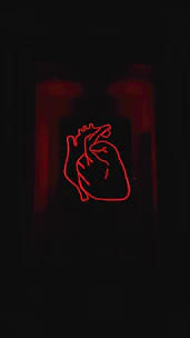 Close-up of hands holding a glowing heart symbolizing inflammation reduction.