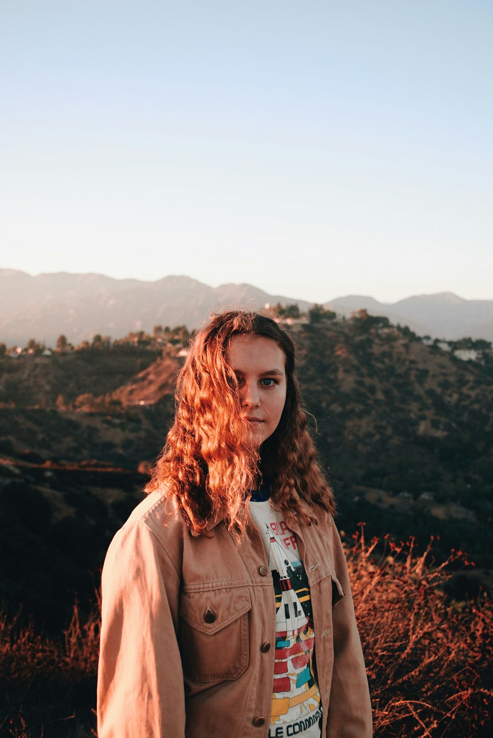 woman wearing brown jacket