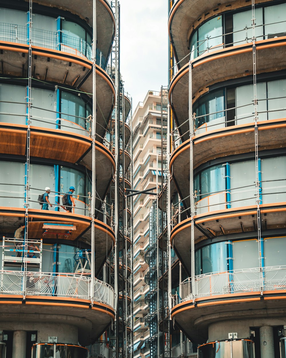 two men in high rise buildings