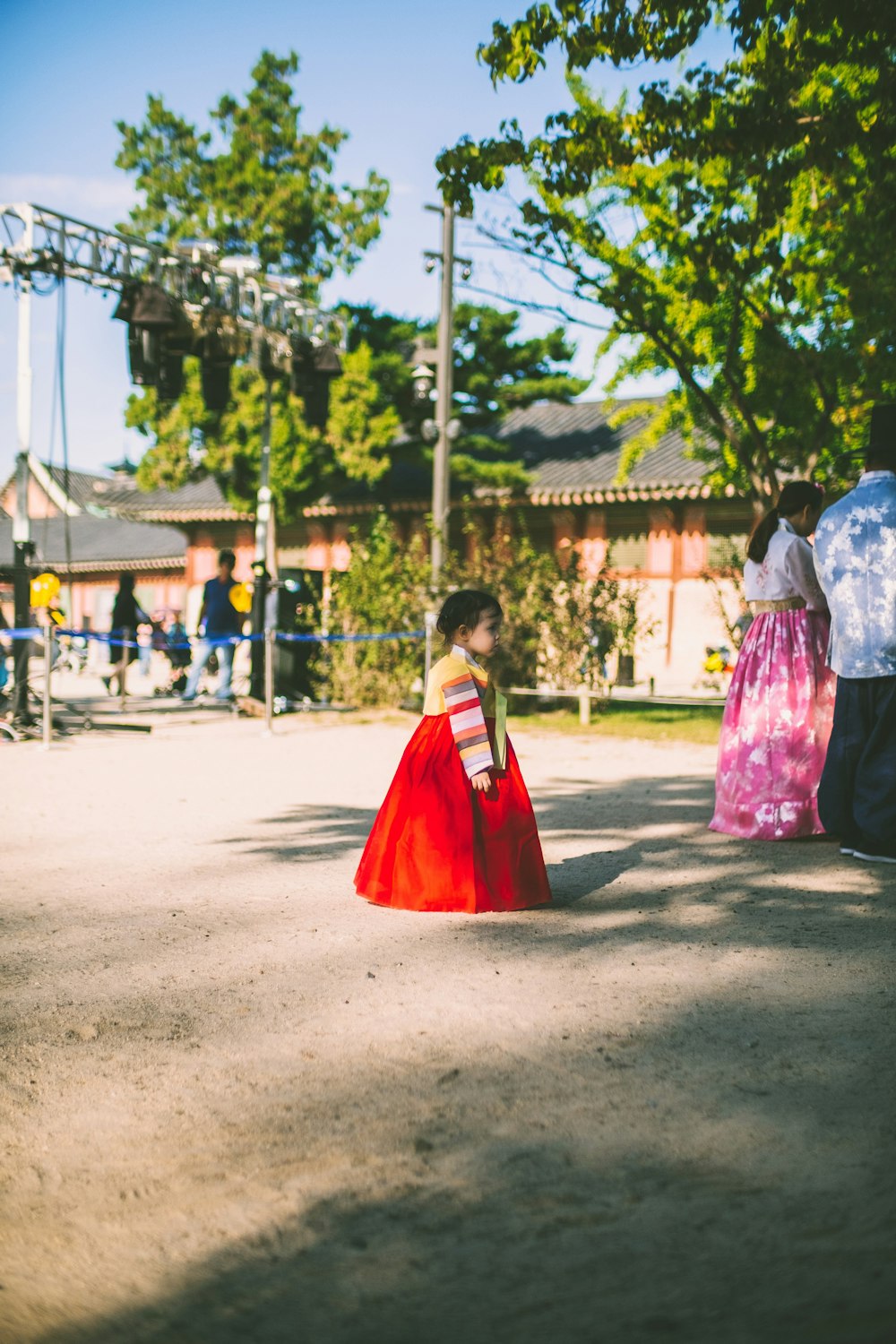 girl standing near pole