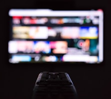 a remote control sitting in front of a television