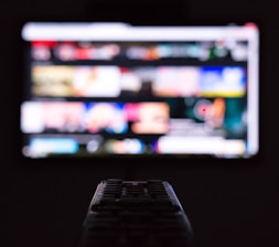 a remote control sitting in front of a television