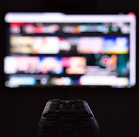 a remote control sitting in front of a television