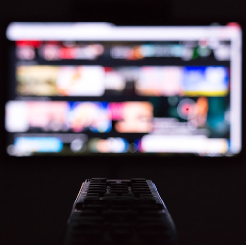 a remote control sitting in front of a television