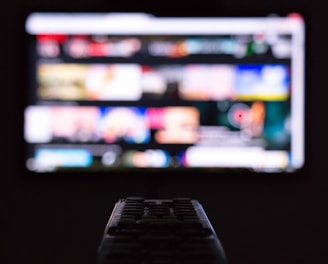 a remote control sitting in front of a television