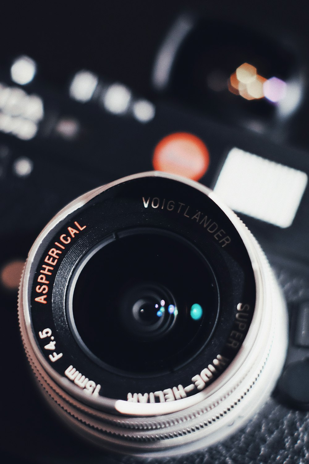 white and black DSLR camera lens