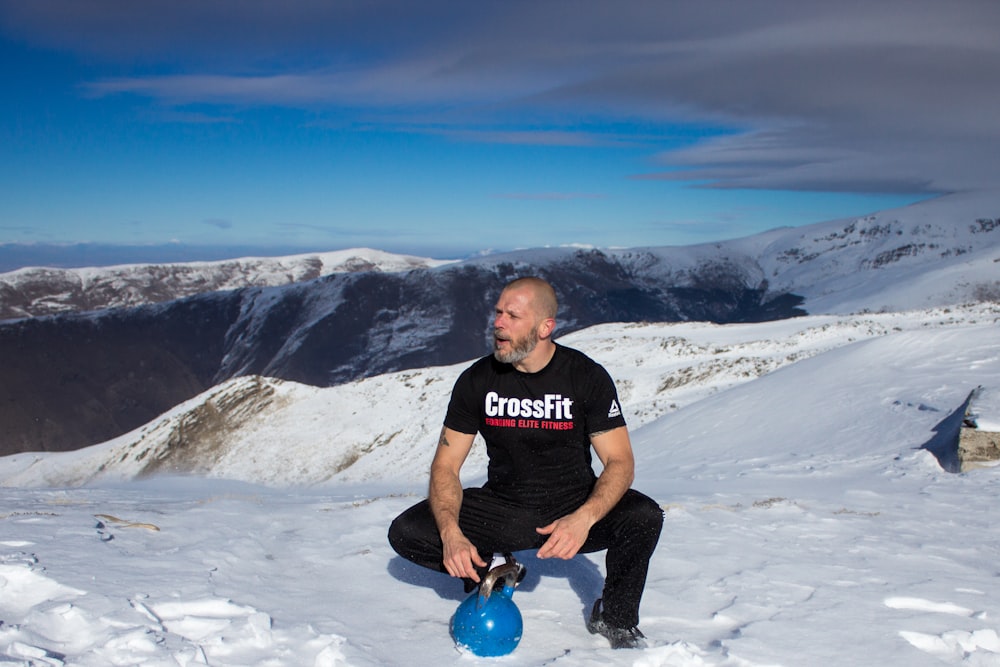 man sitting on snow