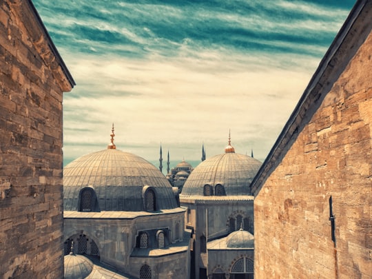 grey concrete dome building during daytime in Hagia Sophia Museum Turkey
