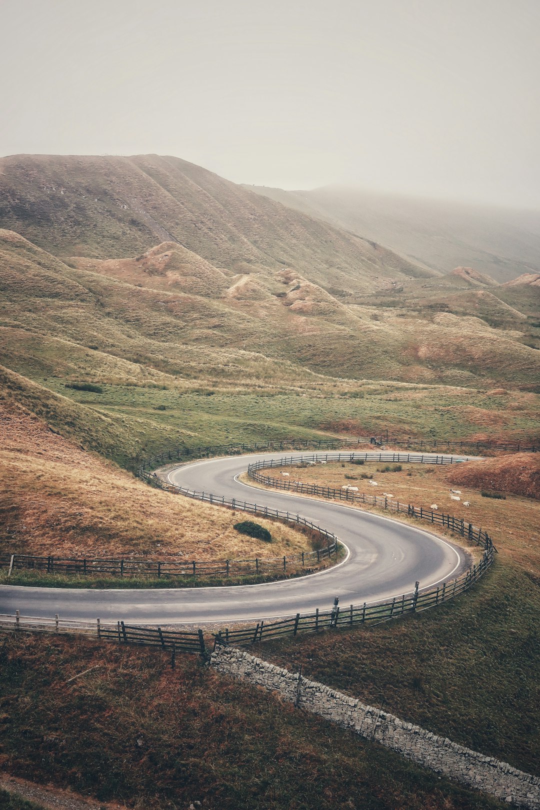 spiral asphalt road near mountains