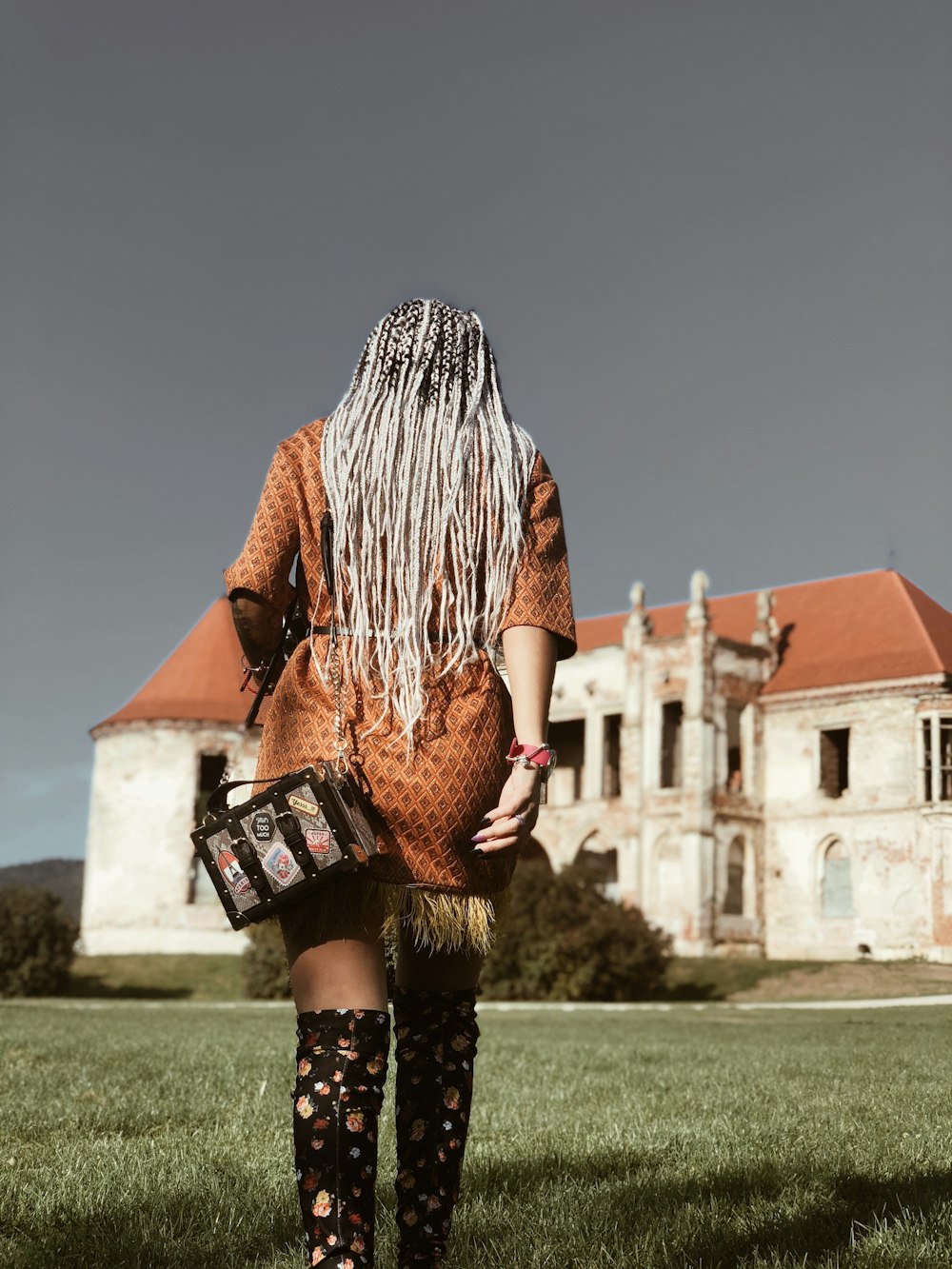 woman walking near building