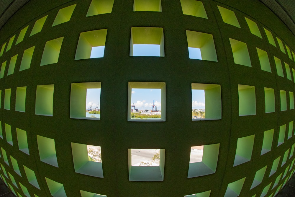 fish-eye photography of black and green grille