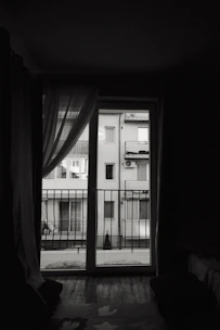 Bedroom of a 2BHK in Jayanagar showing thick black borders on windows and furniture.
