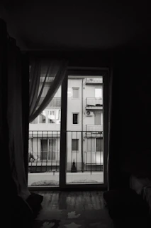 Bedroom of a 2BHK in Jayanagar showing thick black borders on windows and furniture.