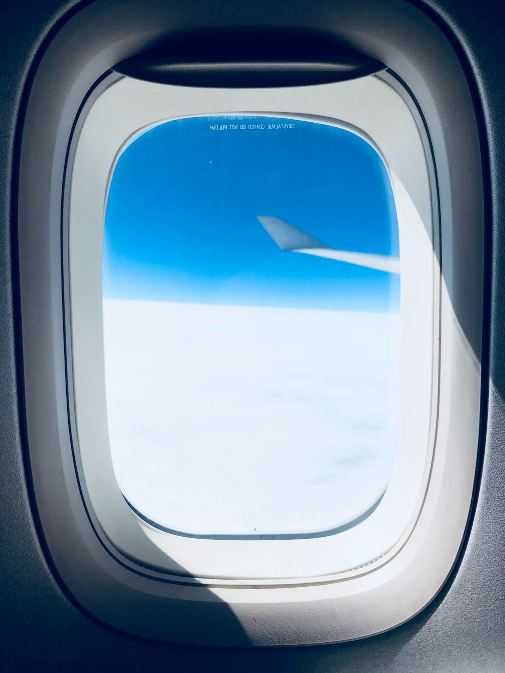 close-up photo of airplane window