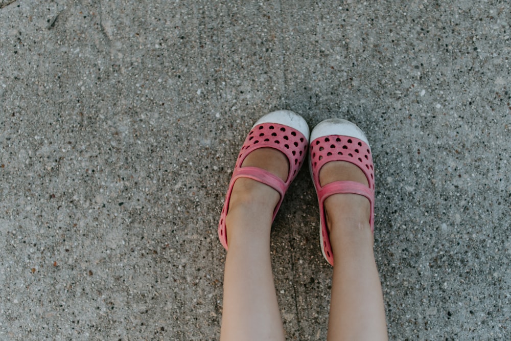 person wearing white and red maryjanes