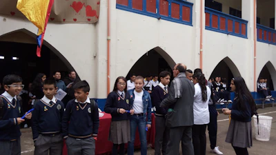 Image of students and parents gathered at a school fundraising fair emphasizing ethical and sustainable practices.